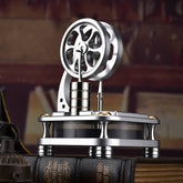 Vertical Stirling engine model on a book