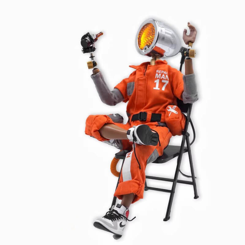 Humanoid cyberpunk desk lamp in orange clothing sitting on a chair