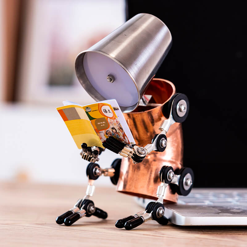 Humanoid cyberpunk desk lamp reading a book