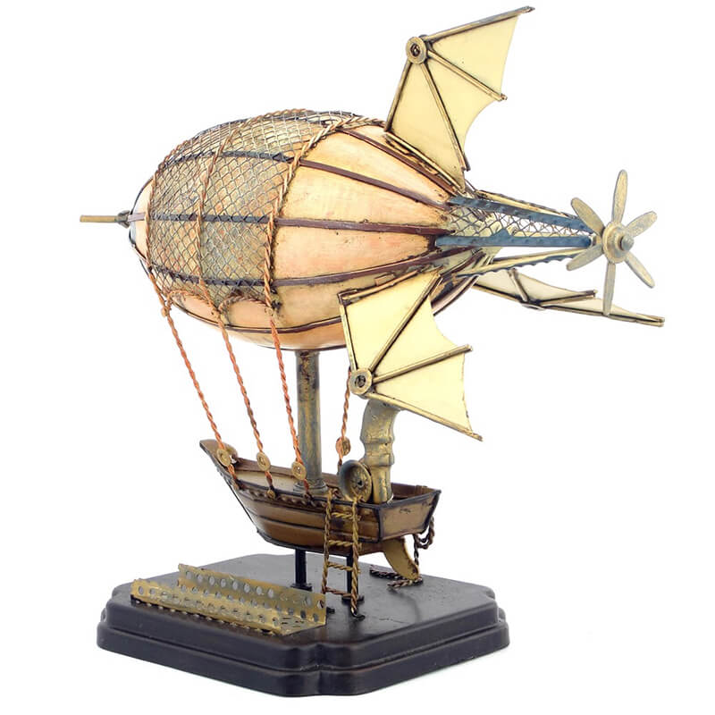 Airship handcrafted metal model placed on a desk back view