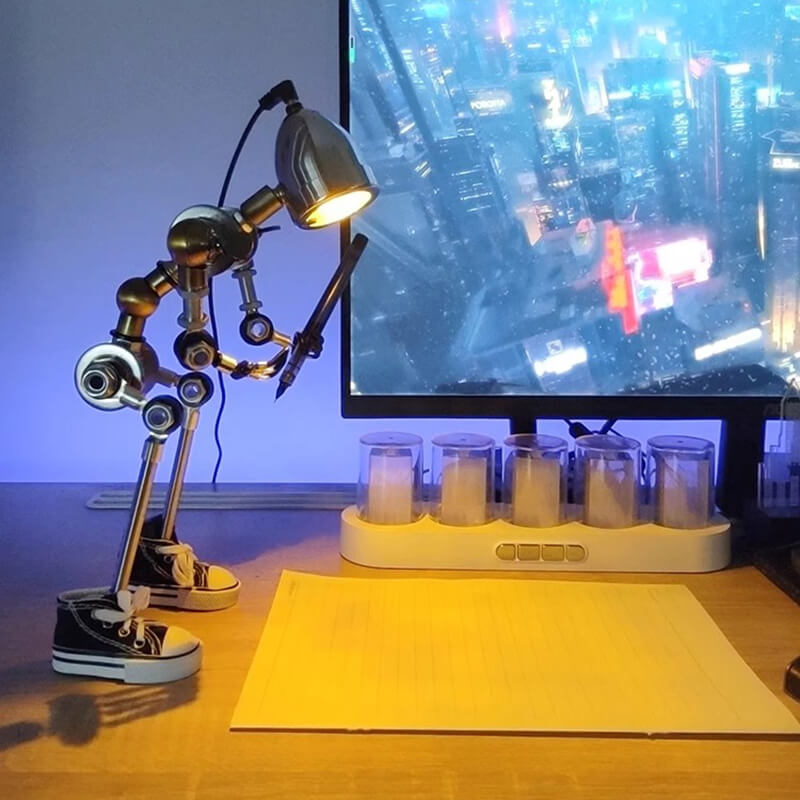 Humanoid desk lamp illuminating a piece of paper